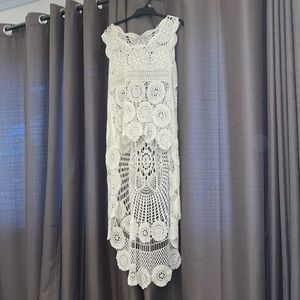 Cream coloured crochet coverup. One size but I would say fits small to medium